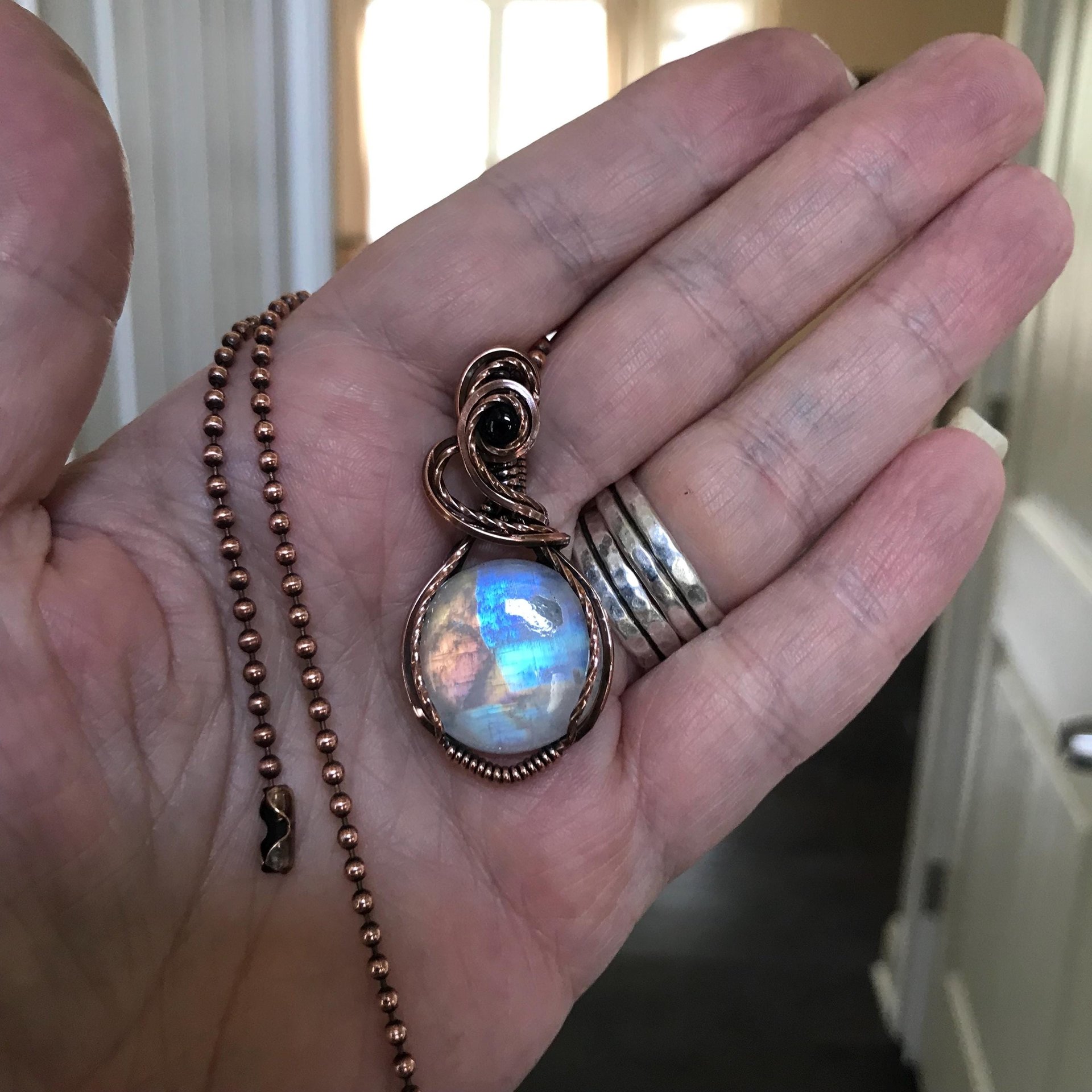 Rainbow moonstone & iolite copper wire wrapped necklace,  Artisan blue orange crystal pendant