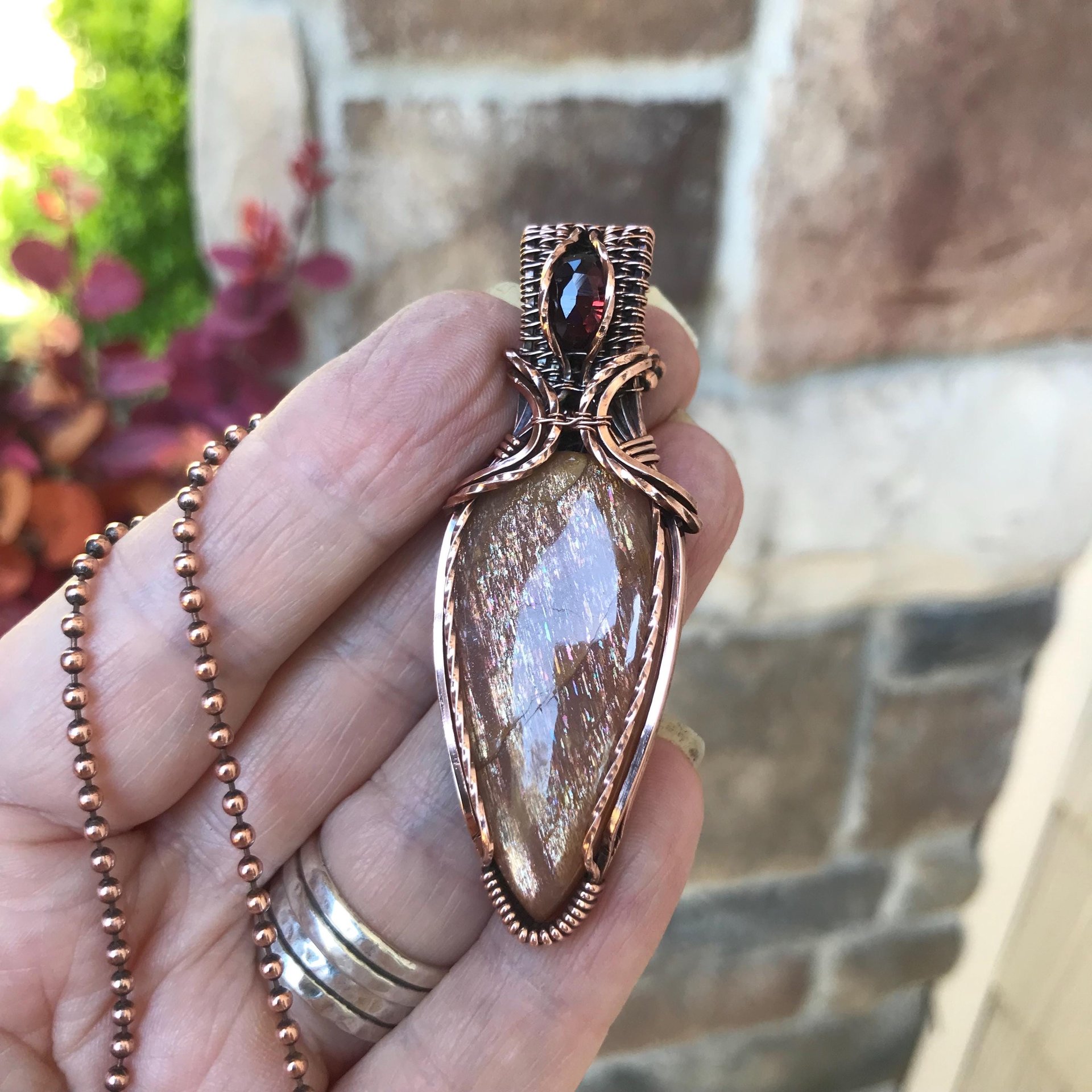 Golden Sunstone & Garnet Copper Pendant with Weaving